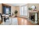 Bright office space with hardwood floors, fireplace, and ample natural light at 989 Woodruff Pl E Dr, Indianapolis, IN 46201