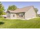Siding home showcasing a well-maintained lawn and the home's exterior at 1021 Boots Trl, Greenfield, IN 46140