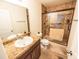Bathroom featuring a walk-in shower, vanity with granite countertop and good lighting at 1021 Boots Trl, Greenfield, IN 46140
