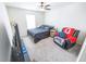 Bright bedroom featuring a bed, chair with an Ohio State blanket, and a flat screen television at 1021 Boots Trl, Greenfield, IN 46140