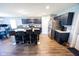 Spacious kitchen featuring a large island with bar stools, stainless steel appliances, and wood floors at 1021 Boots Trl, Greenfield, IN 46140