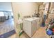 Functional laundry room with washer, dryer, and utility fixtures at 1021 Boots Trl, Greenfield, IN 46140