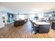 Open-concept living space with kitchen island, fireplace, and stylish flooring at 1021 Boots Trl, Greenfield, IN 46140