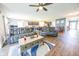 Spacious living room with comfortable seating, an area rug, and a view of the kitchen at 1021 Boots Trl, Greenfield, IN 46140