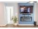 A cozy living room features a modern fireplace, a sleek television and a hardwood floor at 1021 Boots Trl, Greenfield, IN 46140
