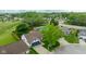 Aerial view showing a home with an in-ground pool, spacious yard, and attached garage at 1084 Lake W Dr, Brownsburg, IN 46112