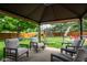Backyard featuring a covered patio, grassy lawn and play area for outdoor enjoyment at 1084 Lake W Dr, Brownsburg, IN 46112