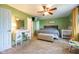Spacious bedroom featuring carpeted floors, a ceiling fan, and ample natural light at 1084 Lake W Dr, Brownsburg, IN 46112