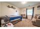 Comfortable bedroom features a sitting area and plenty of natural light at 1084 Lake W Dr, Brownsburg, IN 46112