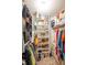 Walk-in closet with custom shelving and ample storage at 1084 Lake W Dr, Brownsburg, IN 46112
