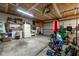 Spacious garage featuring a variety of gym equipment and storage solutions at 1084 Lake W Dr, Brownsburg, IN 46112