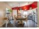 Charming kitchen and dining area featuring stainless steel appliances and modern lighting at 1084 Lake W Dr, Brownsburg, IN 46112
