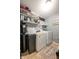 Functional laundry room with modern washer and dryer at 1084 Lake W Dr, Brownsburg, IN 46112