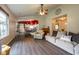 Open-concept living room flowing into the dining area and kitchen, with lots of natural light at 1084 Lake W Dr, Brownsburg, IN 46112