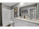 Bright bathroom with a double vanity, modern fixtures, and stylish artwork, offering a functional space at 1136 Tansley Ln, Avon, IN 46123