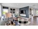 Stylish living room featuring hardwood floors, a comfortable sofa and a TV at 1136 Tansley Ln, Avon, IN 46123