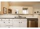 Spacious kitchen with modern appliances, abundant counter space, and white cabinets offering ample storage at 11646 Winding Wood Dr, Indianapolis, IN 46235