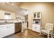 Charming kitchen boasts a rocking chair and a decorative hutch for added storage and personality at 11646 Winding Wood Dr, Indianapolis, IN 46235