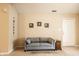 Comfortable living room with neutral walls, carpeted floor, and ample seating at 11646 Winding Wood Dr, Indianapolis, IN 46235