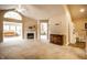 Spacious living room with fireplace, vaulted ceilings, and abundant natural light at 11646 Winding Wood Dr, Indianapolis, IN 46235