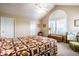 Spacious main bedroom boasts vaulted ceiling, natural light from a window, and a decorative window shade at 11646 Winding Wood Dr, Indianapolis, IN 46235