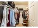 Organized walk-in closet providing ample storage space for clothes, shoes, and accessories at 11646 Winding Wood Dr, Indianapolis, IN 46235