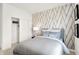 Bedroom featuring a bed with decorative pillows and a closet with sliding doors at 11904 Vale St, Indianapolis, IN 46235