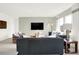 Spacious living room featuring modern furnishings, natural light, and an entertainment center at 11904 Vale St, Indianapolis, IN 46235