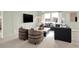 Comfortable living room with contemporary furniture, a large window, and a mounted TV at 11904 Vale St, Indianapolis, IN 46235