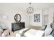 Well-lit main bedroom with luxury vinyl tile floors and a large dresser with vanity at 11904 Vale St, Indianapolis, IN 46235