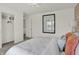 Bright bedroom featuring walk-in closet, white walls and neutral decor at 11916 Vale St, Indianapolis, IN 46235