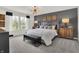Stunning bedroom featuring a large bed, chic lighting, and modern decor at 11916 Vale St, Indianapolis, IN 46235