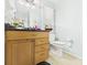 Updated bathroom with modern vanity, black countertops, and sleek fixtures at 12 Windridge St, Country Club Heights, IN 46011