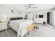 Spacious bedroom features a ceiling fan, a TV, and ample storage at 12 Windridge St, Country Club Heights, IN 46011