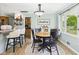 Charming breakfast nook with a round table, comfortable seating, and a bright window is great for casual meals at 12 Windridge St, Country Club Heights, IN 46011