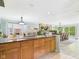 Spacious kitchen island with granite countertops and seamless flow to the dining and living areas at 12 Windridge St, Country Club Heights, IN 46011