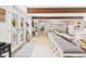 Inviting open living area with tiled floor, stylish decor, and beamed ceiling at 12 Windridge St, Country Club Heights, IN 46011
