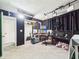 Versatile studio space featuring acoustic panels, workstation setup, and storage at 12 Windridge St, Country Club Heights, IN 46011