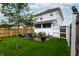 Lush backyard with patio area, a small tree, and a well-maintained lawn at 1207 Chestnut St, Columbus, IN 47201