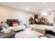 Cozy finished basement featuring carpet, seating area, and ample space for entertainment at 1207 Chestnut St, Columbus, IN 47201