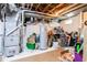 Unfinished basement with exposed ductwork, storage, and a mechanical area at 1207 Chestnut St, Columbus, IN 47201