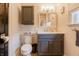 The bathroom showcases a contemporary vanity, updated fixtures, and a built-in storage cabinet at 1207 Chestnut St, Columbus, IN 47201