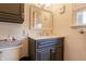 Updated bathroom features a modern vanity with white countertop and gray cabinet at 1207 Chestnut St, Columbus, IN 47201