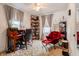 Bright and inviting bedroom featuring a desk, bookshelves, and a cozy red chair for ultimate comfort at 1207 Chestnut St, Columbus, IN 47201