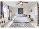 Spacious main bedroom with a ceiling fan, neutral decor, and ample natural light for relaxation and comfort at 1207 Chestnut St, Columbus, IN 47201