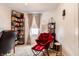 Bright and inviting bedroom featuring a desk, bookshelves, and a cozy red chair for ultimate comfort at 1207 Chestnut St, Columbus, IN 47201