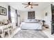 Spacious main bedroom with a ceiling fan, neutral decor, and ample natural light for relaxation and comfort at 1207 Chestnut St, Columbus, IN 47201