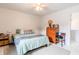 Comfortable bedroom featuring a bed, dresser, and a fun-colored chair, creating a cozy and inviting space at 1207 Chestnut St, Columbus, IN 47201