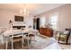 Bright dining room features a decorative fireplace, chandelier, and hardwood floors at 1207 Chestnut St, Columbus, IN 47201