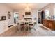 Bright dining room featuring a chandelier, dining table, and decorative fireplace at 1207 Chestnut St, Columbus, IN 47201